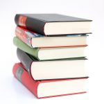 A stack of five best books that can be used as a reference to advance your knowledge on SEO.