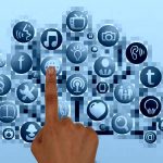A hand pointing to a collection of digital icons representing social discovery.