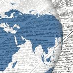 A globe showing continents in blue overlaid on a background of newspaper text.