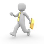 A gray 3D figure with a yellow tie running with a yellow briefcase in hand.
